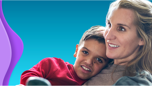 Photo of woman holding child at her chest