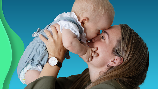 Photo of woman holding baby above head